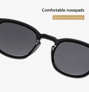 Close-up of comfortable ergonomic nose pads on vintage round black frame glasses