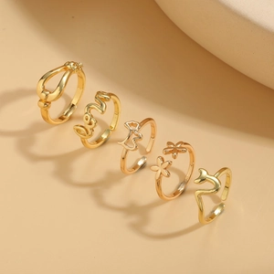 Five-piece set of adjustable 14K gold plated minimalist rings featuring floral and cat shapes