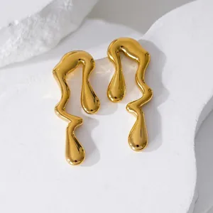 Minimalist golden fluid lava earrings with irregular liquid drop design in polished steel