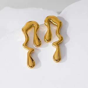 Minimalist golden fluid lava earrings with irregular liquid drop design in polished steel