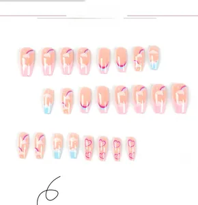 Close-up of long coffin press-on nails set featuring rainbow cloud and heart designs