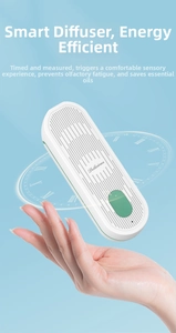 Detailed side view of the white smart aroma diffuser with green accents and button controls
