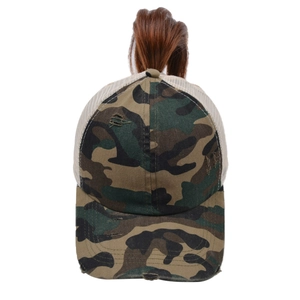 Detail of distressed camouflage mesh cap with high ponytail opening for women