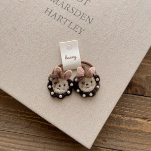 Detail of embroidered bunny hair ties with pearls on high-elastic bands for girls