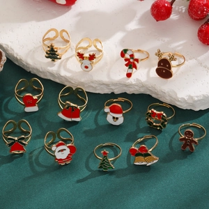 Detail shot of various Christmas enamel rings including Santa Claus and reindeer designs