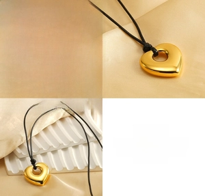 Detailed macro view of the hollow heart pendant in gold-plated stainless steel