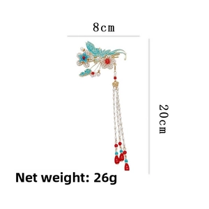 Détail de la pince à cheveux papillon avec dimensions 8cm par 20cm et poids de 26g
