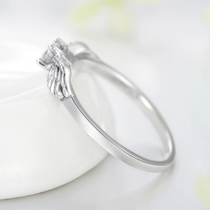 Vintage S925 sterling silver angel wing ring with a clear sparkling centerpiece stone