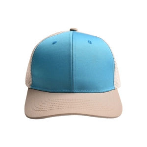 Detail of teal cotton and beige mesh panels on a breathable outdoor sun hat