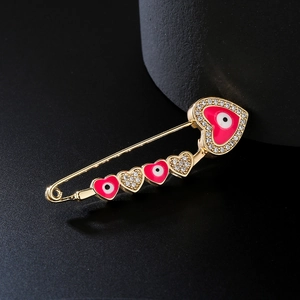Exquisite 18K gold-plated devil eye brooch featuring red hearts and sparkling crystals
