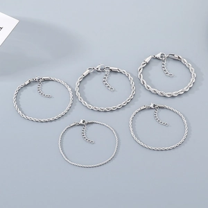 Five assorted silver twisted rope chain bracelets with lobster clasps and extension links