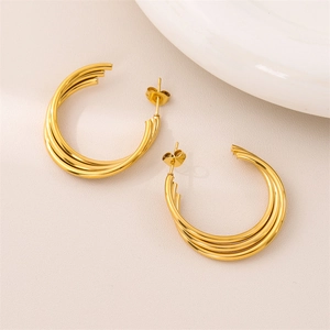 Polished gold triple hoop earrings in minimalist stacked design for women