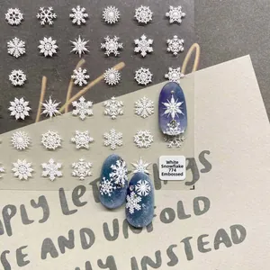5D embossed white snowflake nail art stickers with 3D texture for winter manicure