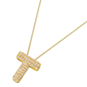 Close-up of gold-plated letter T necklace pendant paved with shimmering white zircons