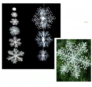 Vertical white snowflake garland ornaments featuring detailed crystalline textures for Christmas