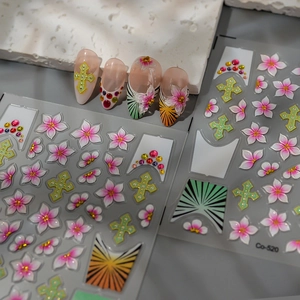 Detail of 3D ice flower nail stickers with gradient pink petals and cross charms