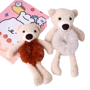 Cute teddy bear plush hair ties in brown and cream white on a clean white background