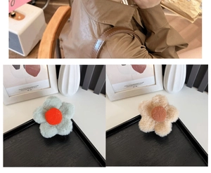 Detail of plush flower hair claw clips in beige and grey soft faux fur styles