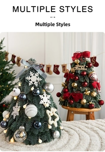 Close-up of two mini Christmas trees with warm LED lights and assorted ornaments