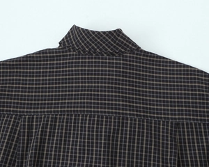 Close-up of the collar and back shoulder stitching on this plaid cotton shirt
