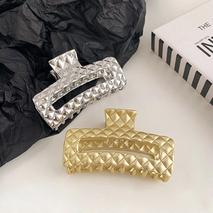 Glossy gold and silver metal shark hair clips with classic quilted pattern for women