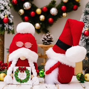 Festive knitted Christmas gnomes pair with braids, beard and Christmas Wishes sign