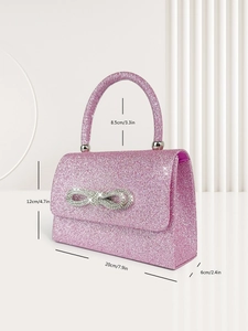 Pink glitter handbag with crystal bow and detailed dimensions in centimeters and inches