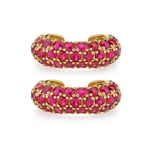 Macro shot of gold ear cuffs with pavé set micro ruby zircons in a vintage French style