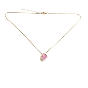 Detail of pink cylindrical pendant with gold heart on a gold chain necklace