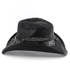 Close-up of black straw cowboy hat featuring metallic studs on faux leather band