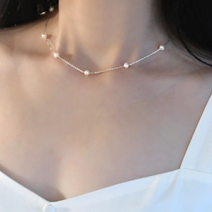 Close-up of elegant freshwater pearl choker necklace on a model for everyday wear