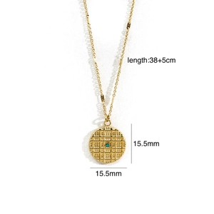 Detailed view of 14K gold-plated necklace with a checkered pendant and blue gemstone