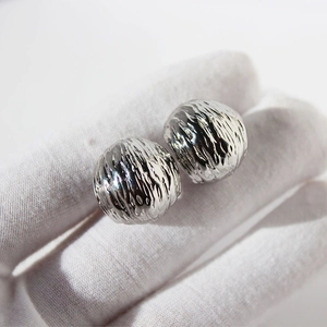 Minimalist silver wavy texture C-shaped hoop earrings with a brushed metallic finish