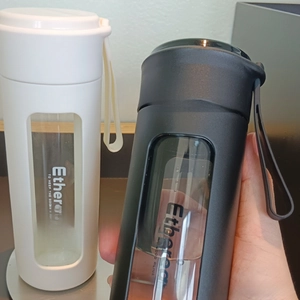 Detail view of double-layer portable bottle with borosilicate glass liner and PP shell
