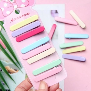 Set of eight gradient matte candy-colored BB hair clips on a pink polka dot card