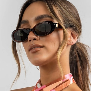 Retro oval sunglasses in tortoiseshell frame with gold accents and dark lenses for women