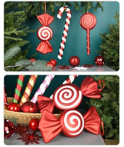 Detail of red candy-shaped ornaments and striped candy canes for Christmas tree decor