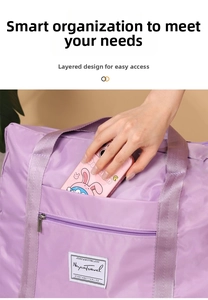 Detail of purple travel bag featuring a front zipper pocket for easy phone storage
