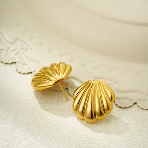 Elegant 18K gold plated stainless steel shell shaped stud earrings on white pedestal