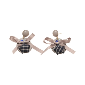 Boucles d'oreilles élégantes avec nœud en tissu et pendentif étoile pour femme