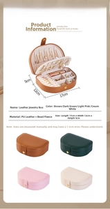 Detail view of semi-circular PU leather jewelry box with four color options and interior slots