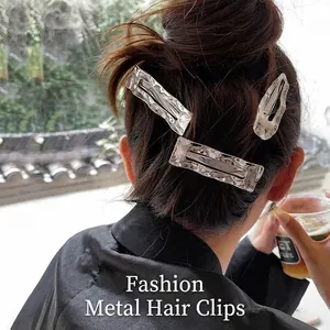 Three-piece silver metal hair clip set featuring a textured hammered finish for women