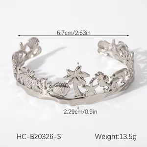 Detailed macro view of marine ocean life cutouts on a polished stainless steel bangle