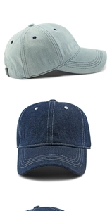 Detail view of denim baseball cap showing contrast stitching and metal adjustment buckle