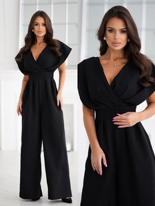 Detail of elegant black V-neck wide-leg jumpsuit with waist-tie and fluid drape fabric