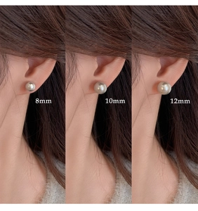 Comparison of 8mm 10mm and 12mm white pearl stud earrings shown on human ear model