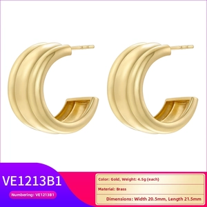 Detailed view of architectural gold C-shape earrings showing size 20.5mm x 21.5mm specs