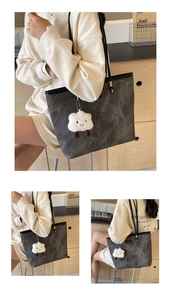 Deep grey leather tote bag with cloud charm detail shown in stylish lifestyle settings