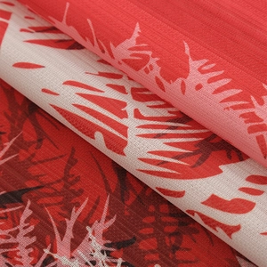 Christmas themed blackout curtains with red abstract floral print and textured fabric