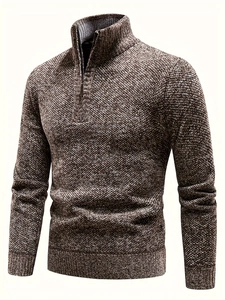 Detail of brown-grey cable knit texture and stand collar zipper on men sweater